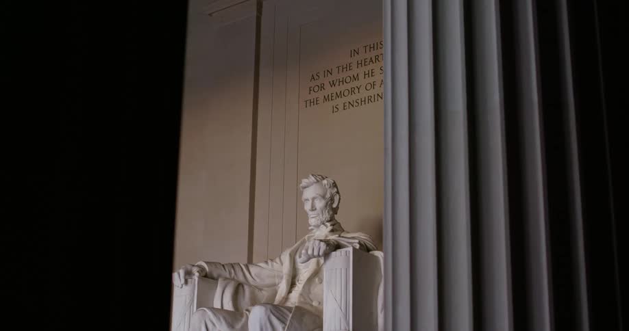 The sun shines on the lincoln memorial statue
