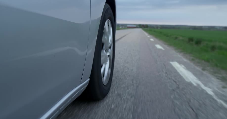 A car is driving on a road