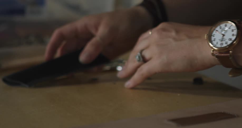 A person places object on worktable
