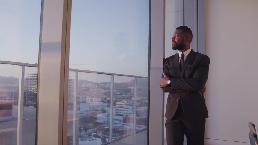 A man is standing in an office
