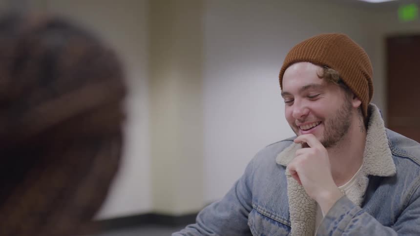 Students talking in a library