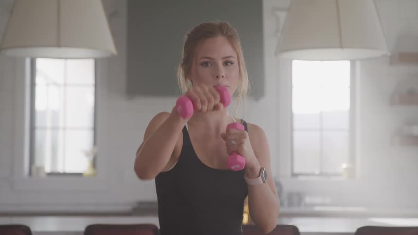 A woman is exercising indoors