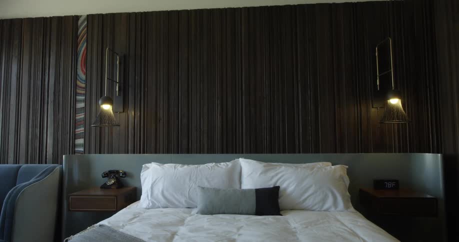 An inviting bed in a luxury hotel in the daytime
