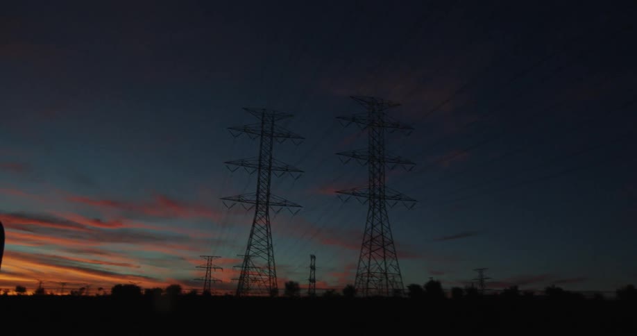 Power line towers at sunset