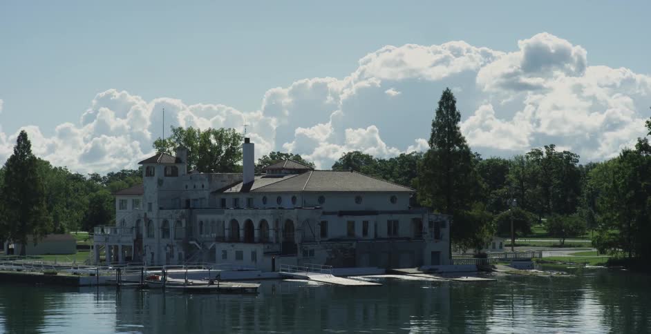 Clouds float over a lakefront building