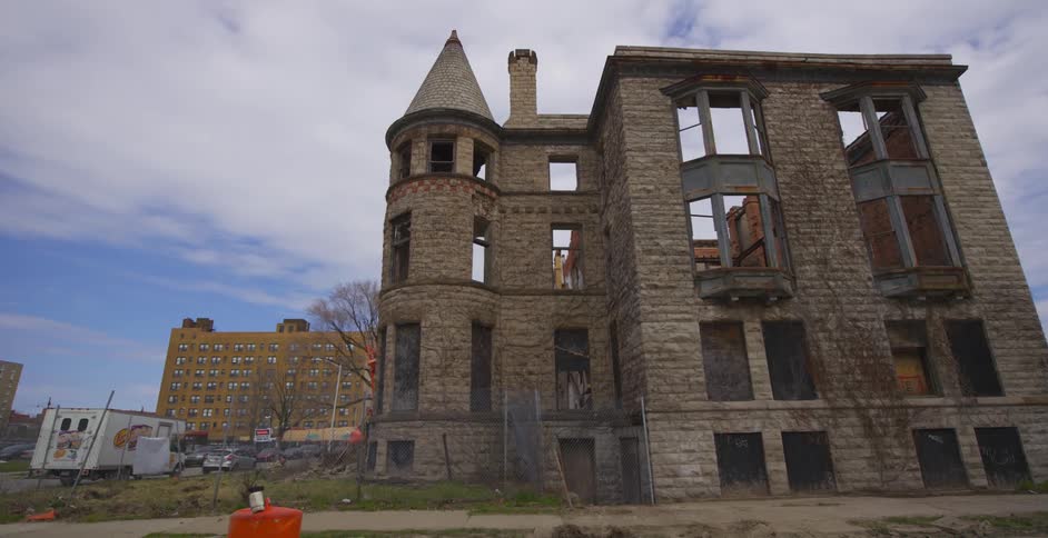 An abandoned building towers overhead