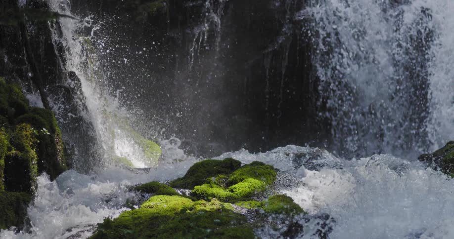 A mossy waterfall in brilliant light