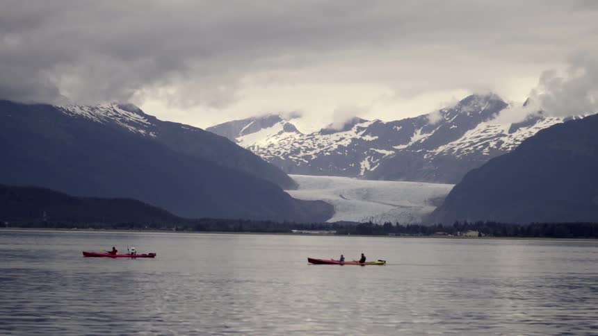 Canoes float on a mountain lake