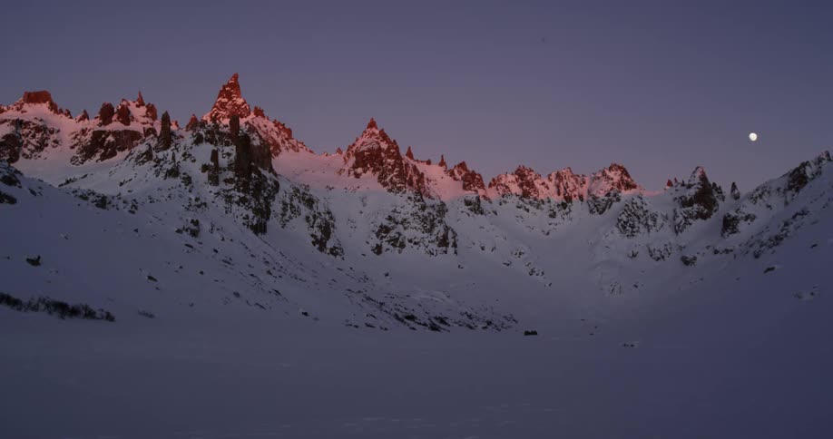 The moon over snow covered mountains