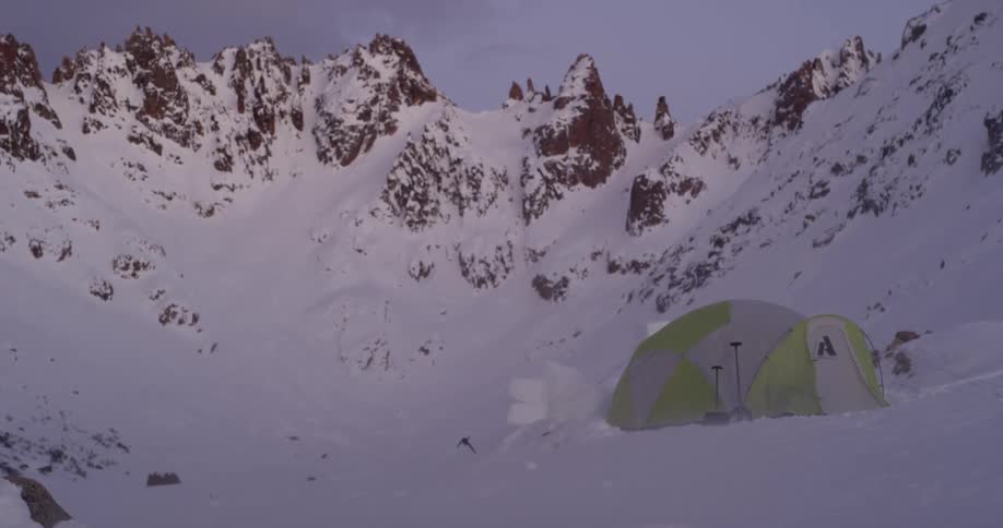 Wind blows on a tent in the snowy mountains