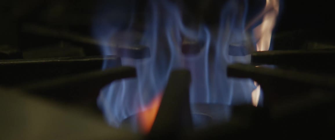 A stove top burner is turned off