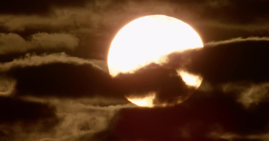 Clouds moving in front of the sun