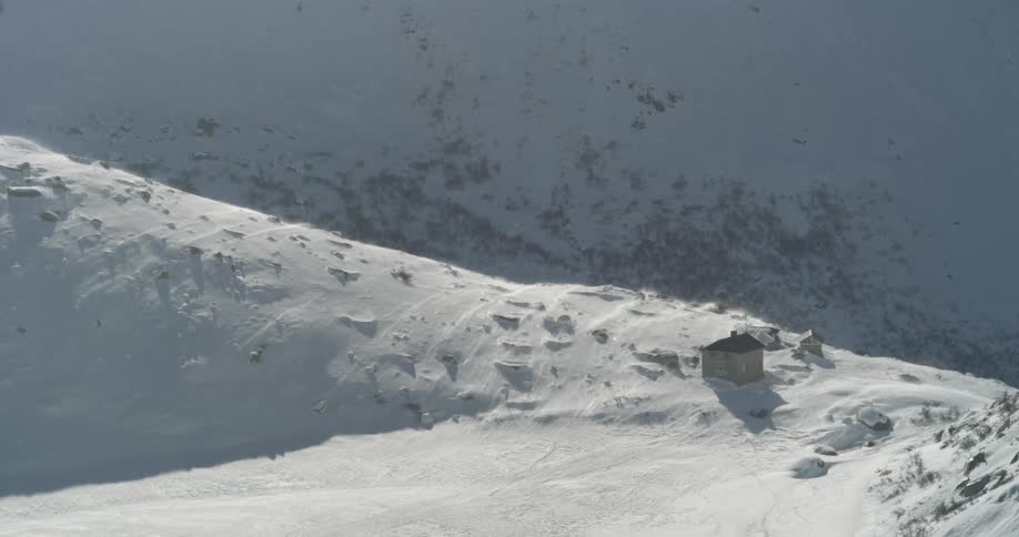 A hut in the snowy mountains