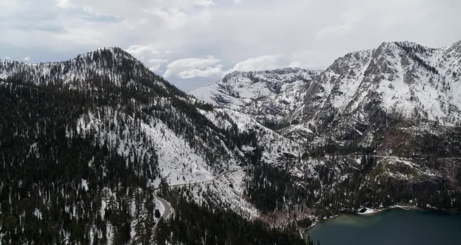 The lake meets the edge of the mountain range