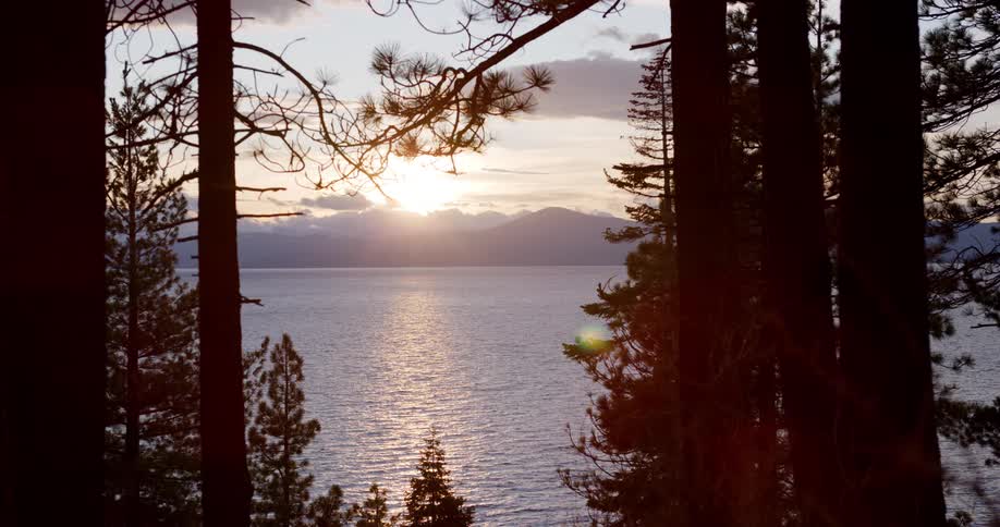 The sun is setting among the lake