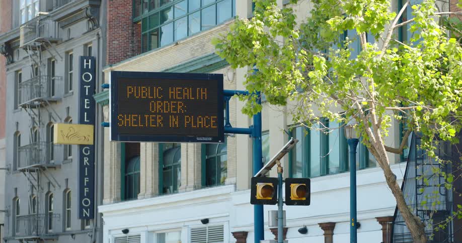 A sign in a downtown area