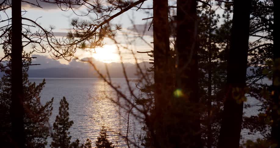 The sun setting over a lake