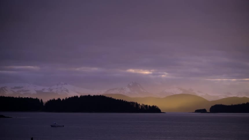 A boat on a lake at sunrise