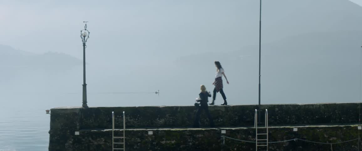 Women walking on a pier
