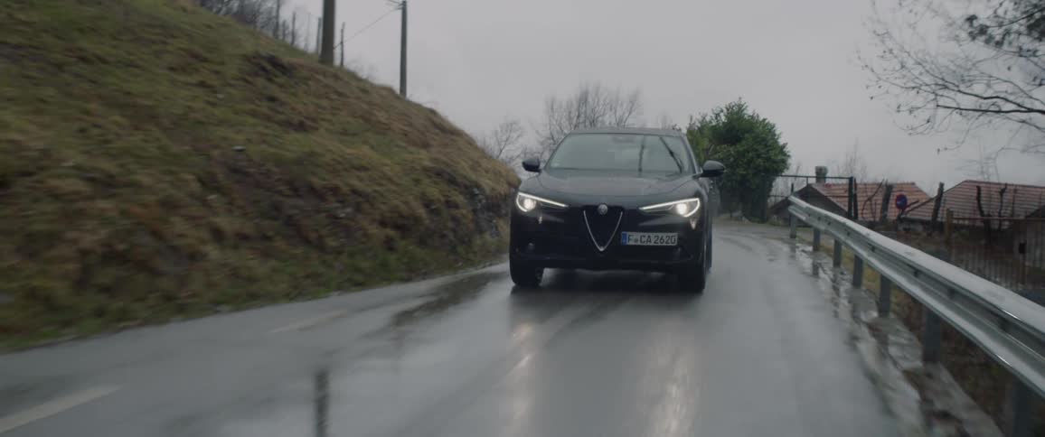 Couple Driving Up Mountain Road