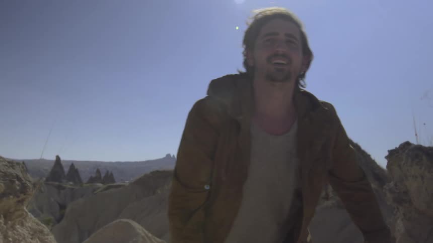 A man walks up a mountain