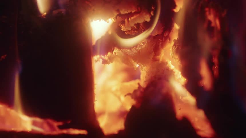 Flames rise as wood burns in a bonfire