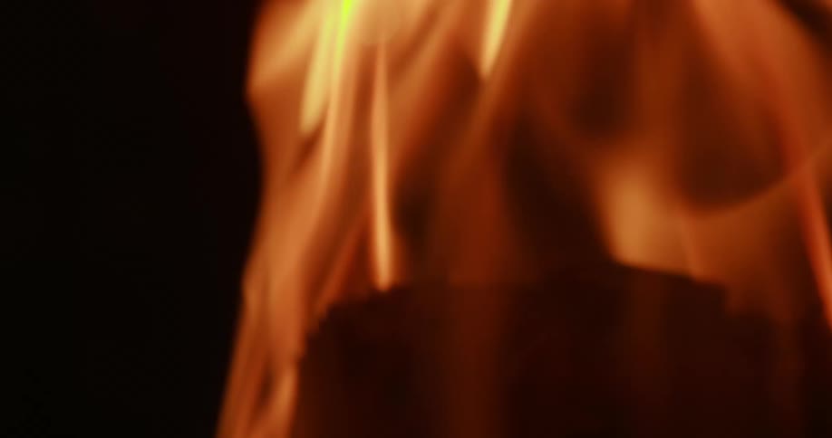 Flames rise as a fire burns
