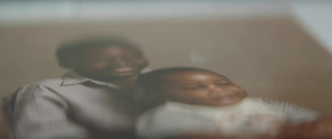 A photo is on the table of two children