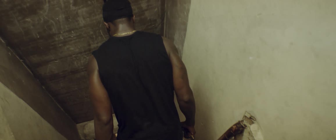 A man walks down a corridor