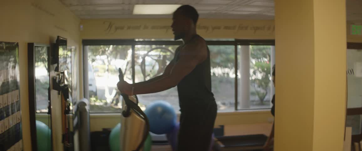 A man is working out in a gym