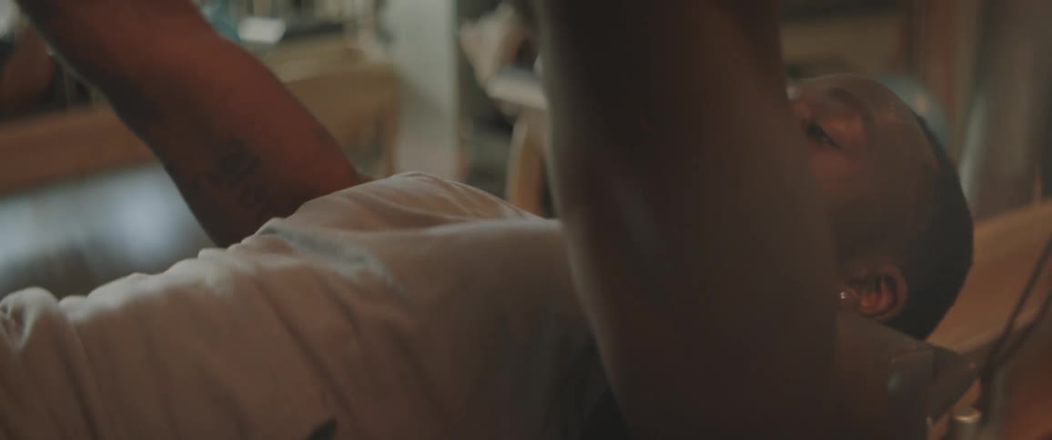 A man is exercising on gym equipment