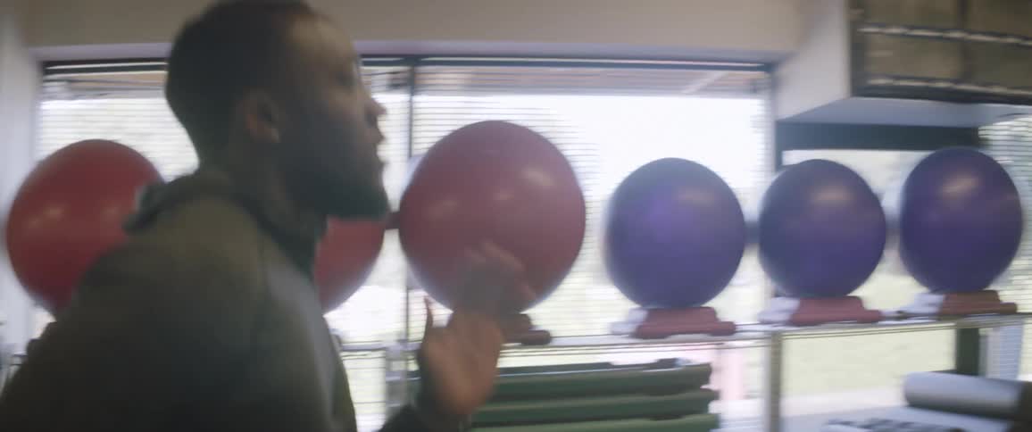 Man jogs in a gym