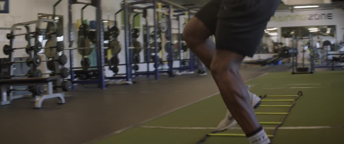A man performs agility drills