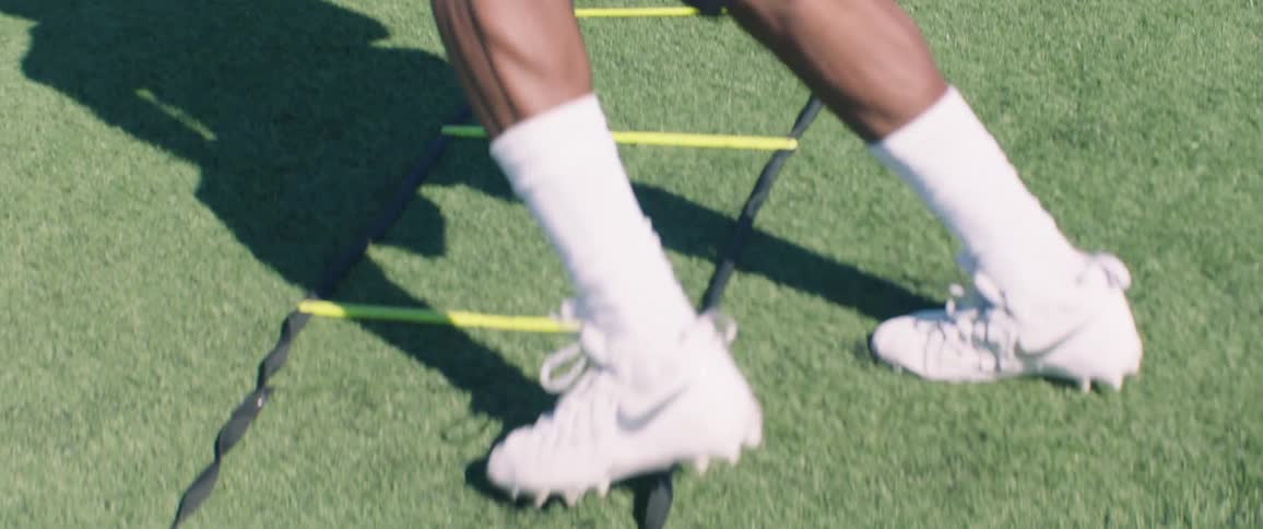 A man performs agility drills