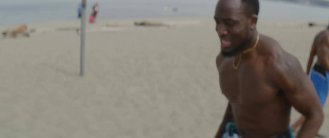 Men are exercising on the beach