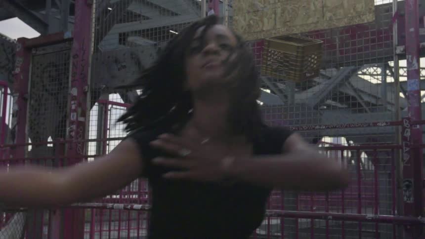 A woman is dancing outside