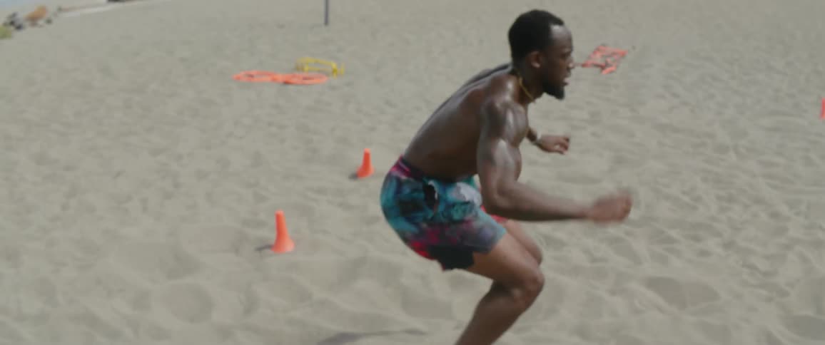 A man does a workout on sand