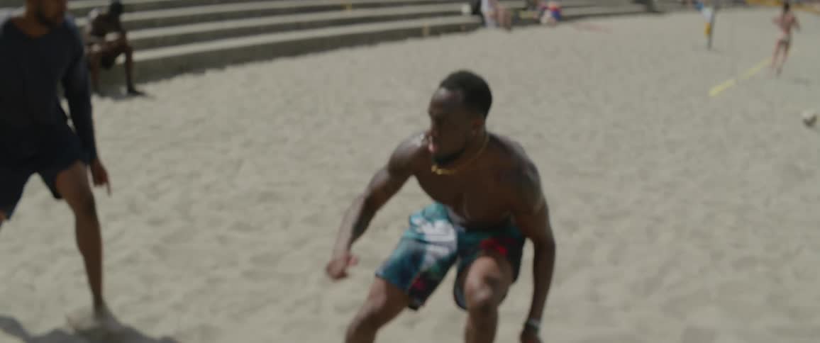 A man does some laps in the sand