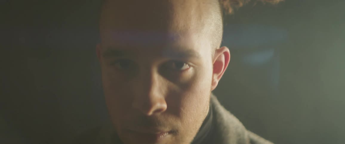 Light shines on a man as he moves