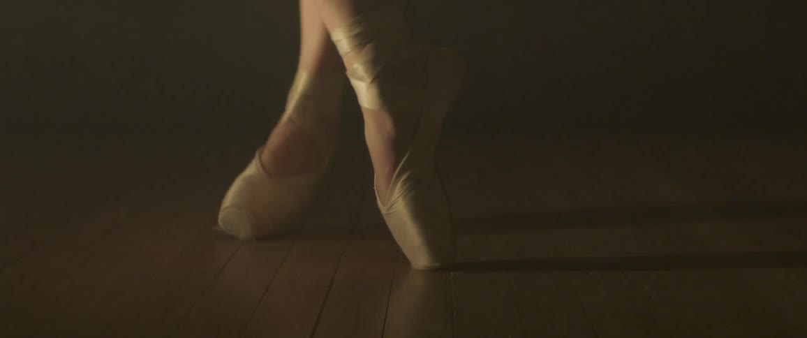 A dancer twirls on one food