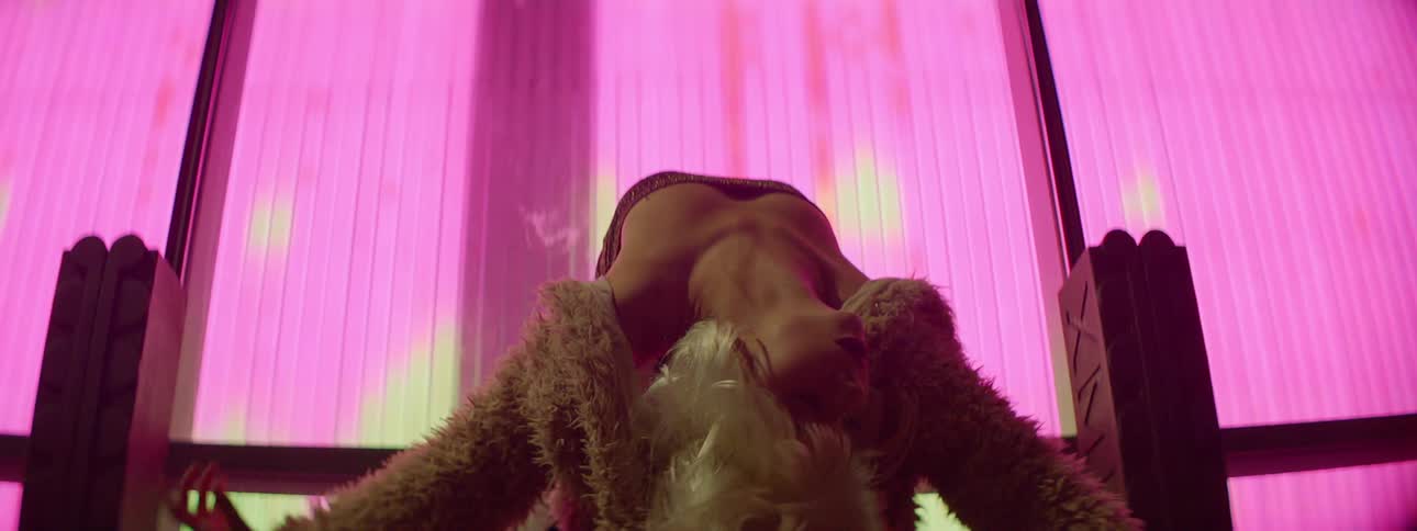 A woman is dancing and doing a performance