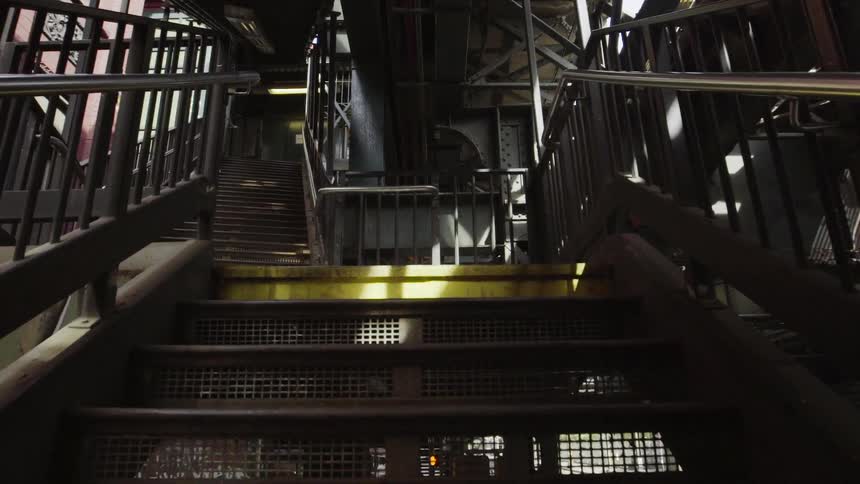 Walking up a metal staircase