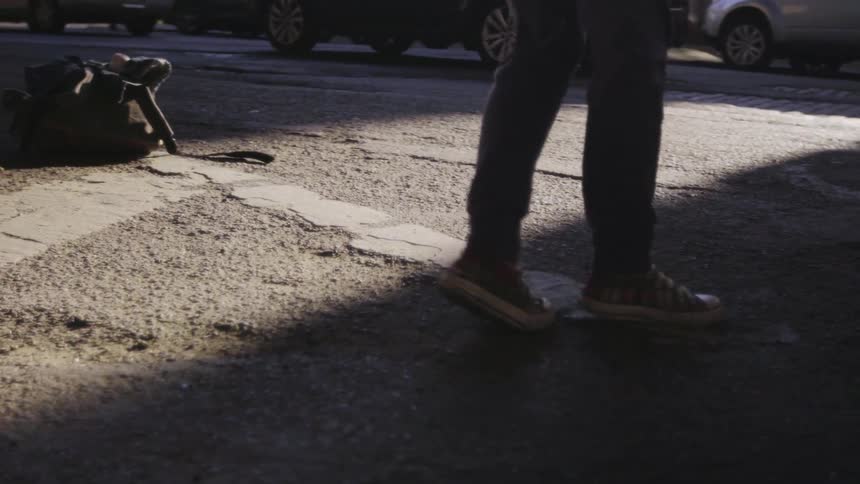 A person is dancing in the street