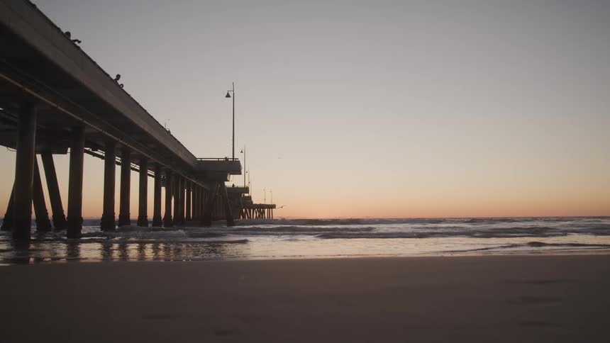 The beach is displayed while the sun is setting