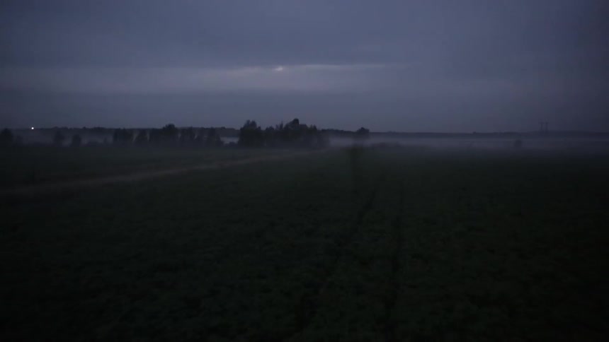 A mist covered landscape at night
