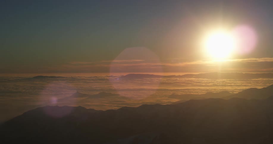 The sun over a mountain range