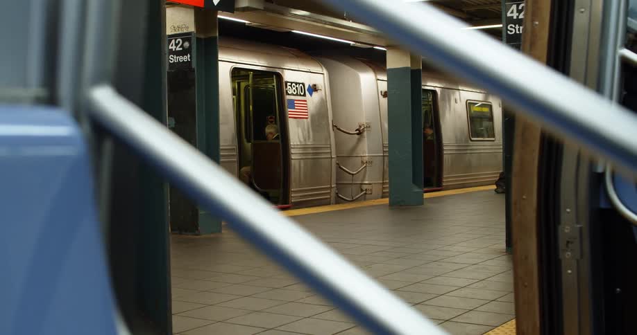 Subway cars stopped next to the platform