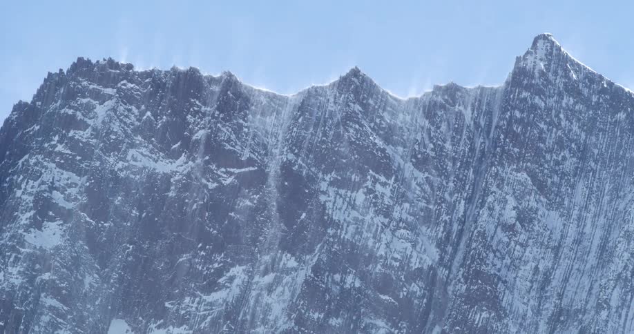 Wind blows across stunning vertical mountains