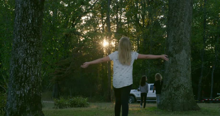 Three girls walk towards the truck