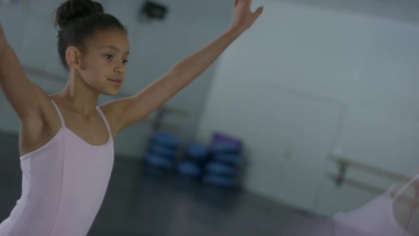 A child is performing ballet